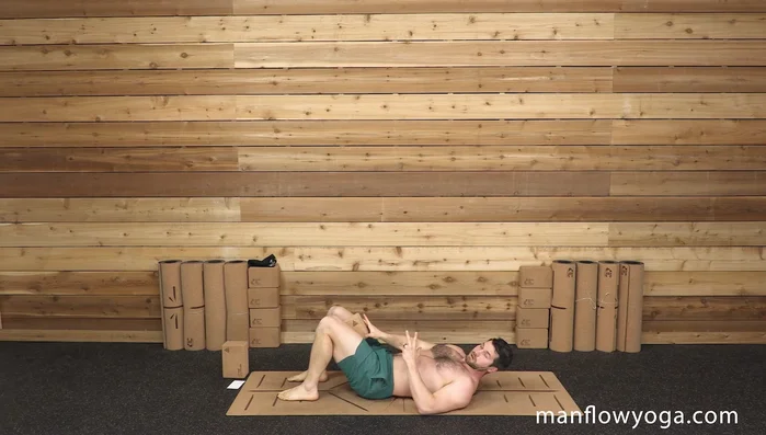 Bring your knees over your hips and place the block on your thighs.