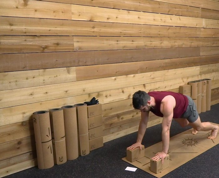 Bend your knees, shift your hips up and back, and press thighs backward.