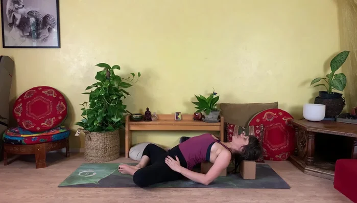 Relax your arms by your sides, open them to the sides, or bend your elbows and place hands overhead for a deeper stretch.