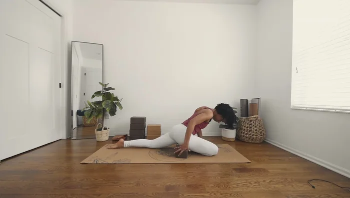 Place a yoga block underneath your hip for support.