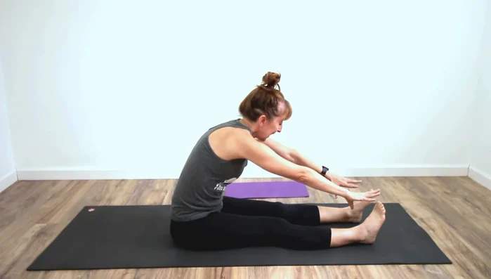 Deepen Forward Fold: Determine if tight hamstrings or calves are limiting your forward fold by using the wedge under your heels. If it allows you to go further, it indicates tight calves.