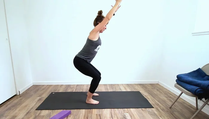 Deep Squat Modification: Use the wedge under your heels to facilitate a deeper squat by supporting the heels and improving ankle flexibility.