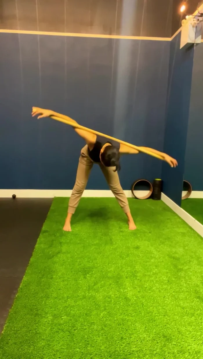 Perform spinal rotations by facing one side of a wall and then the other, noticing the stretch in your chest and shoulder opening.