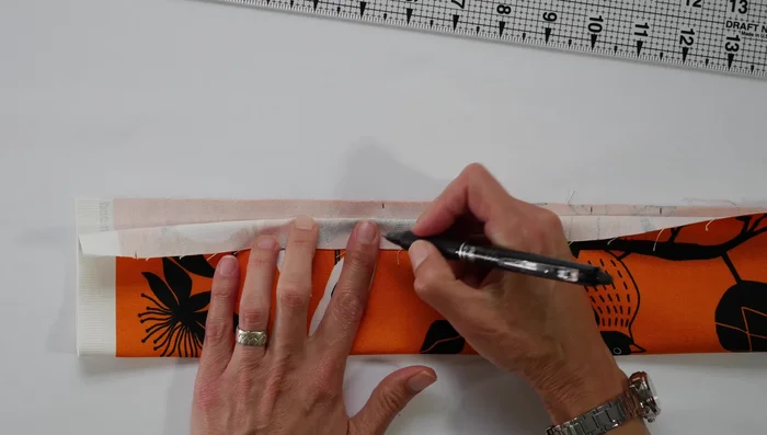 Baste the pleats: Use your sewing machine to baste the pleats down. Iron the pleats flat.