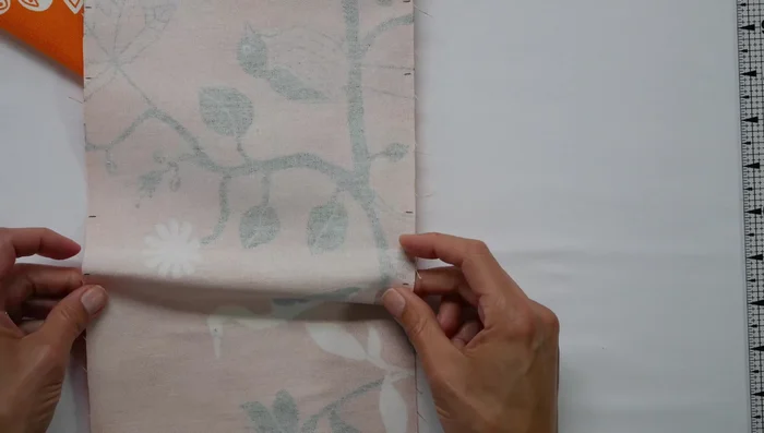 Baste the pleats: Use your sewing machine to baste the pleats down. Iron the pleats flat.