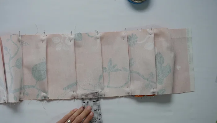 Baste the pleats: Use your sewing machine to baste the pleats down. Iron the pleats flat.