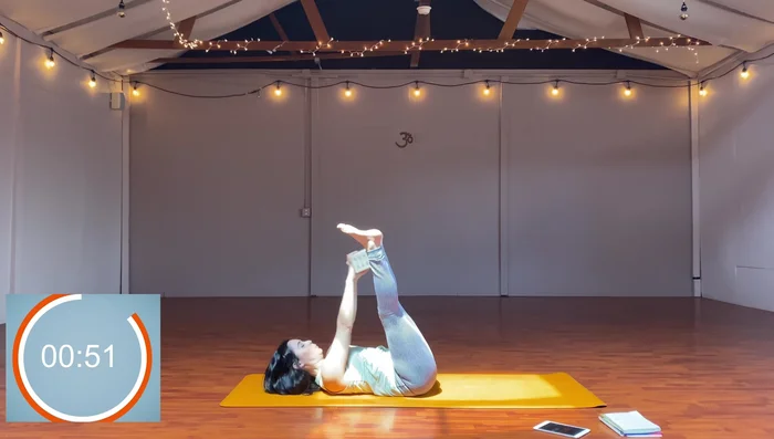 Straddle, reach block through legs, put block in feet, move block side to side.