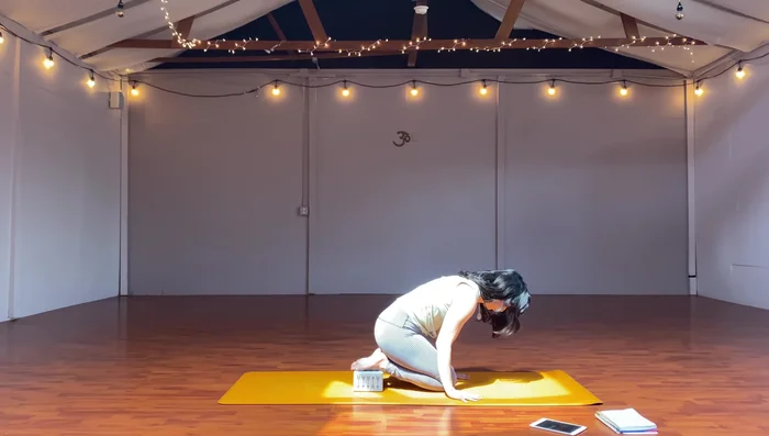 Kneeling position, hands under shoulders, lift hips, nose to knees, lower.