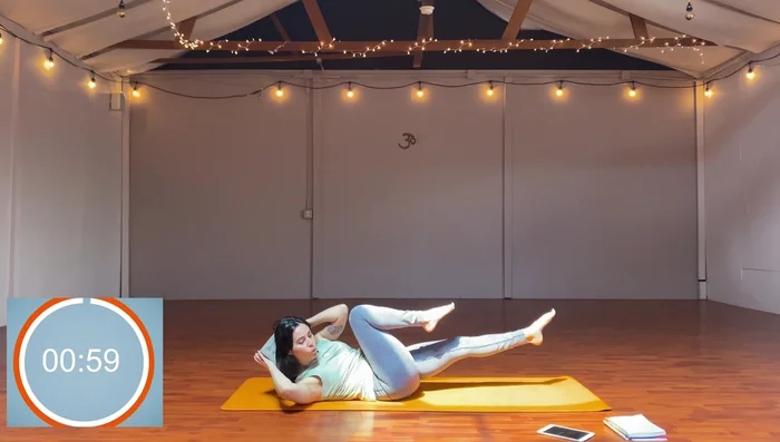 Block behind head, lift shoulders and head, do criss-cross (bicycle crunches).