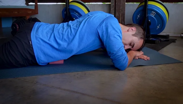 Rest your forehead on your forearms for deeper relaxation and stability.