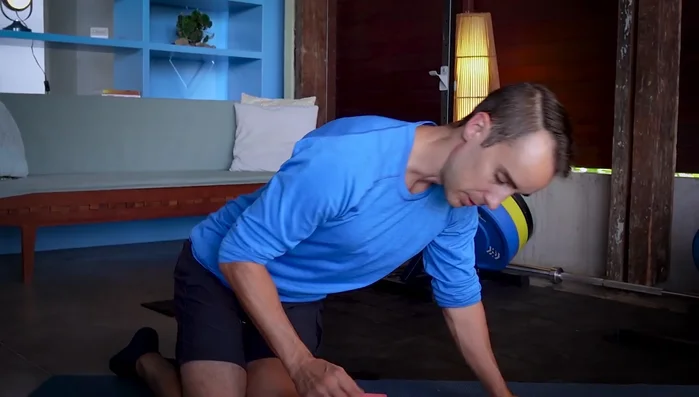 Adjust your position to find a comfortable spot, using one hand to hold and adjust the wedge and the other hand to adjust your body.