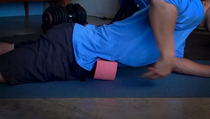 Adjust your position to find a comfortable spot, using one hand to hold and adjust the wedge and the other hand to adjust your body.