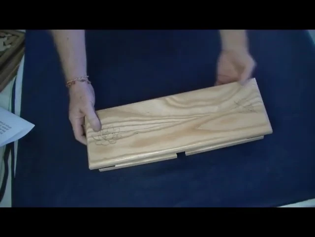 The presenter describes the symbolism of the Lotus flower.
