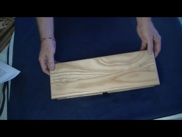 Close-up of the ash wood bench, highlighting its grain and texture.