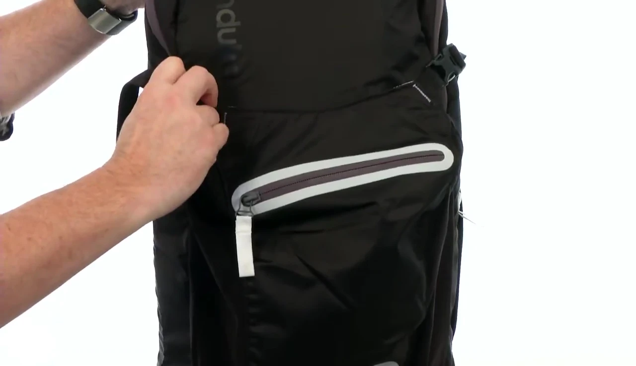 Detail of the pressure-release buckles on the yoga mat compartment.
