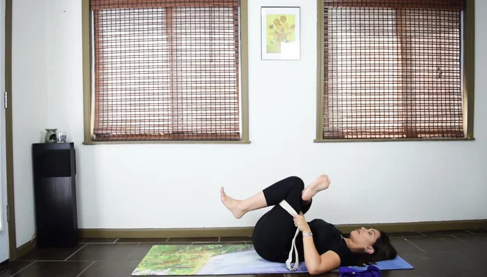 Repeat for Reclining Hand-to-Big-Toe Pose, using the strap to assist in leg extension.