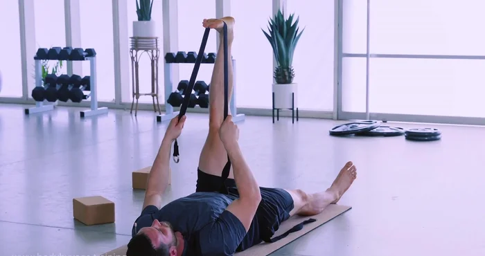 Flex toes down, press back of knee forward, working deeper into the stretch. Use exhale to deepen, inhale to maintain.