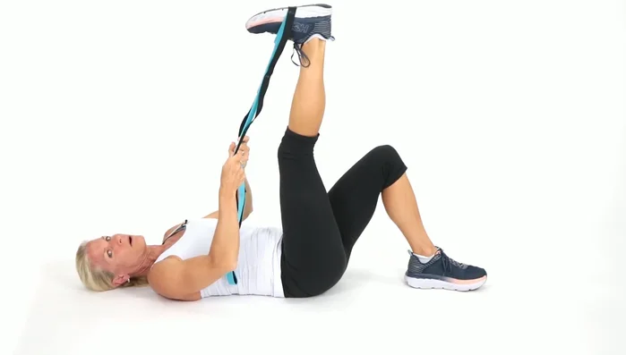 Point and flex your right foot to stretch your calf and ankle.