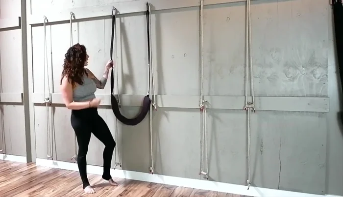 Press the sling down firmly to secure it against your body.