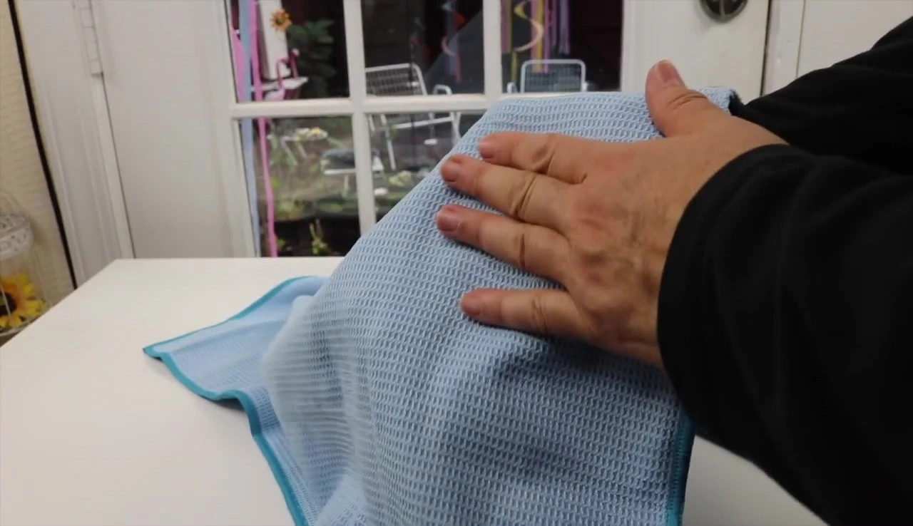 Top side of the yoga towel for laying on