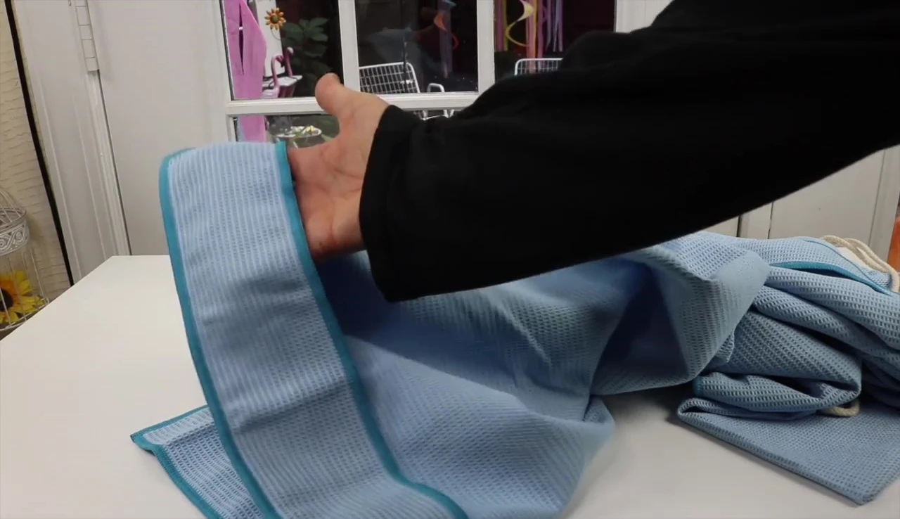 Sleeves securing the towel on the mat