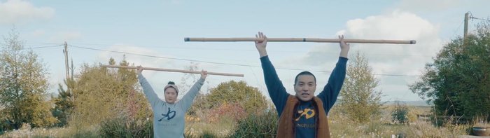 Inhale & Expand: Inhale, expanding your chest and raising your hands to the height of your shoulders.