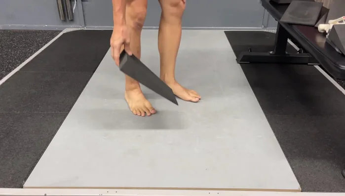 Hinge Technique with Large Wedges: Proper positioning helps improve posture and balance during hinge exercises.
