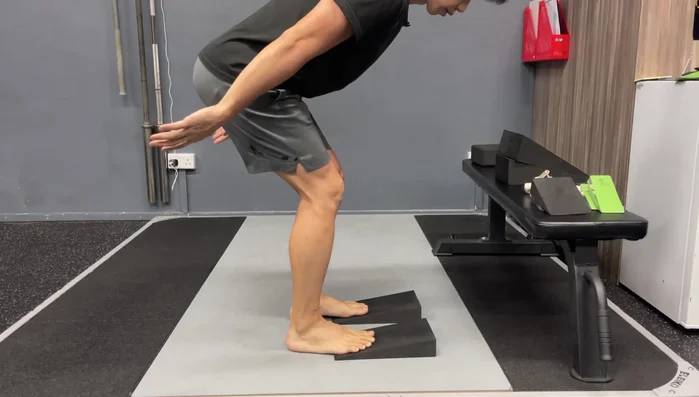 Hinge Technique with Large Wedges: Proper positioning helps improve posture and balance during hinge exercises.