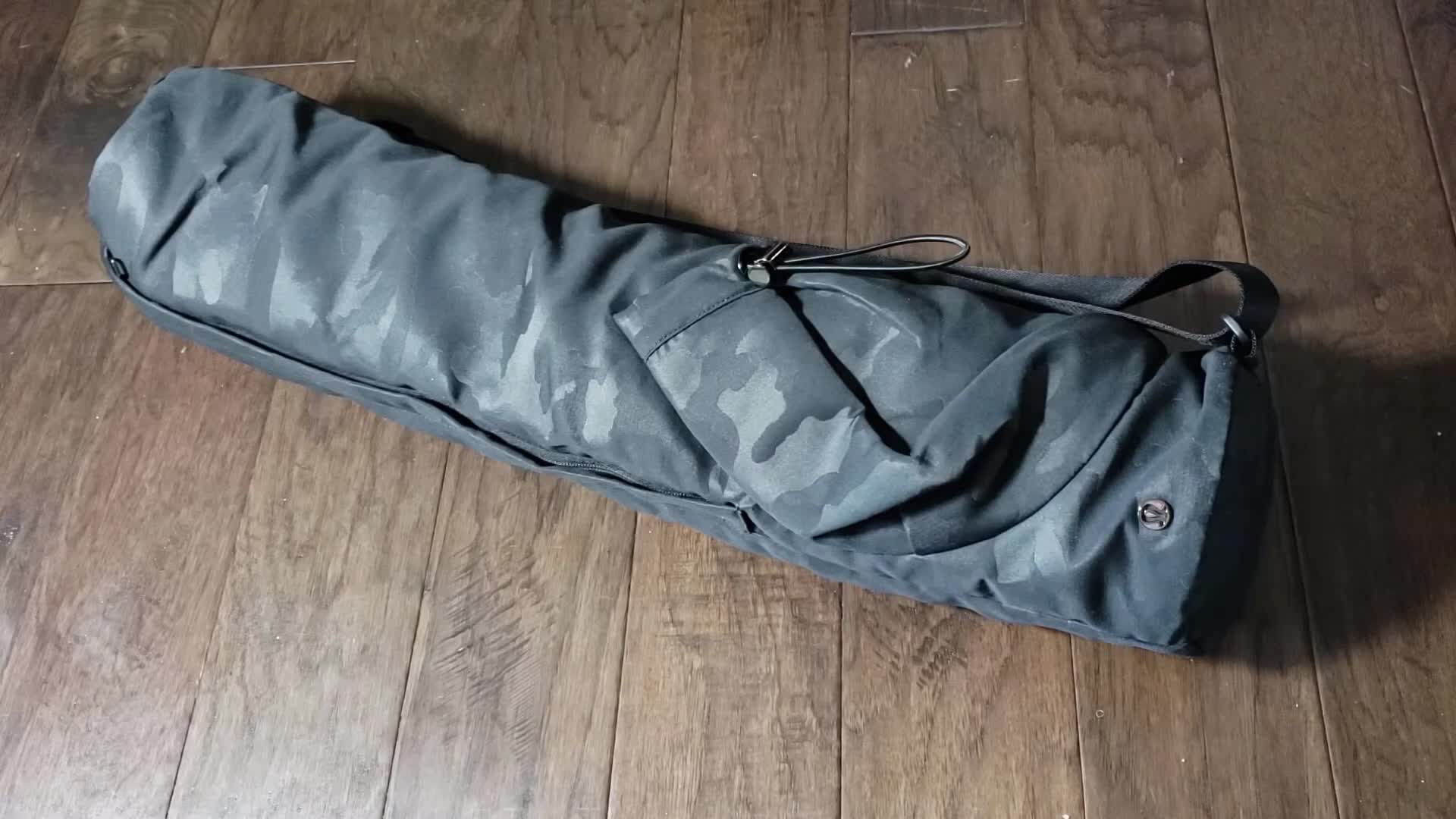 Close-up of the Lululemon Yoga Mat Bag in Heritage Camo Jacquard Max Black.