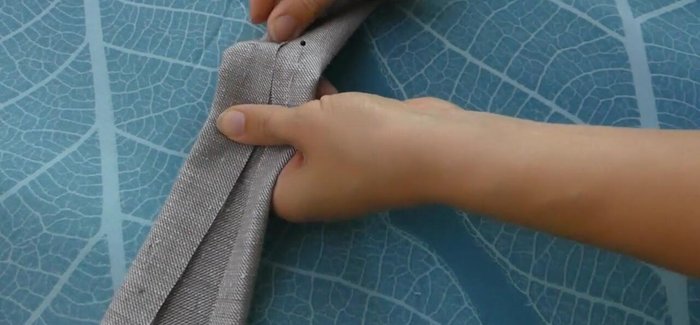 Prepare the strap: Press the long edges of the 5x35 inch strip 1 inch to the inside, fold in half, and top stitch along both long sides.