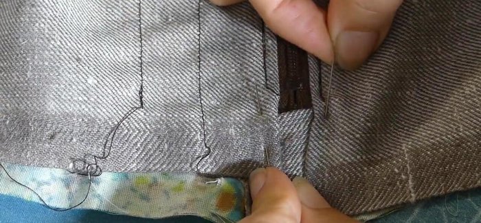 Top stitch along both sides of the zipper using a zipper foot to keep it close to the coil, going through both outer and inner fabrics.