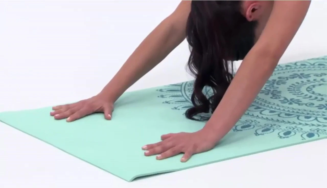 A person demonstrating a yoga pose on the Gaiam mat to highlight grip and comfort