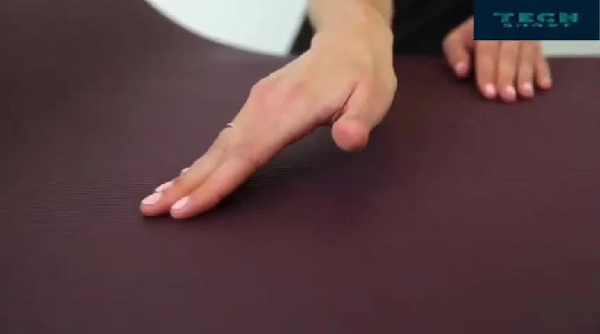 Person using the mat, demonstrating its grip and support.