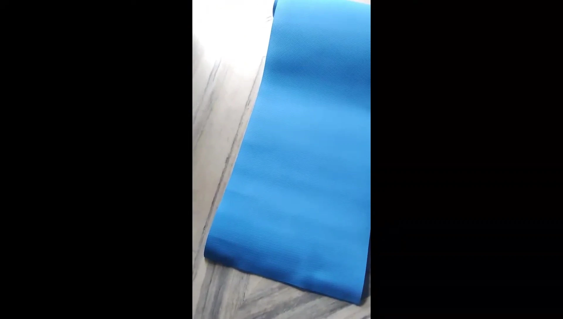 Shot of the mat in use during a yoga session