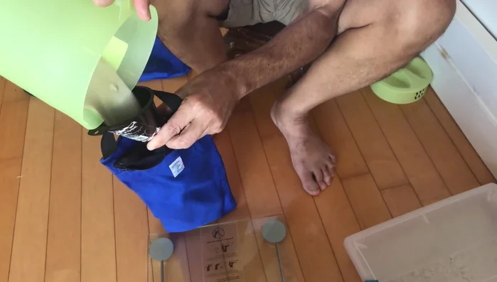 Zip the inner bag closed. Then, place the filled inner bag into the outer bag with the handle.