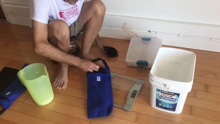 Shake the inner bag gently to settle the sand as you fill it.