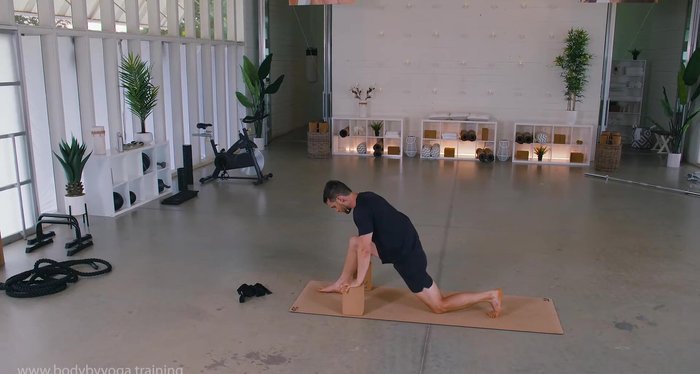 Use blocks for back support. Hold, breathing deeply.