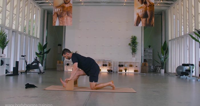 Optional: Use blocks on either side of left foot. Squeeze glutes, drive hips forward, push into left foot. Breathe.