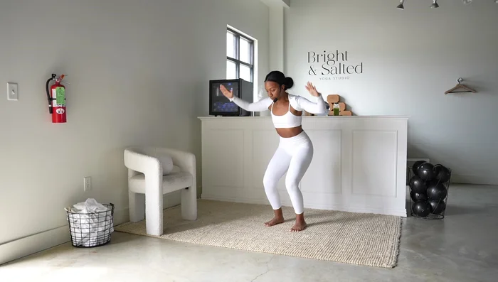 Chair Pose Shoulder Flys: Bend elbows and perform shoulder flys, closing and opening your arms while squeezing shoulder blades together. Maintain tension in knees and thighs.