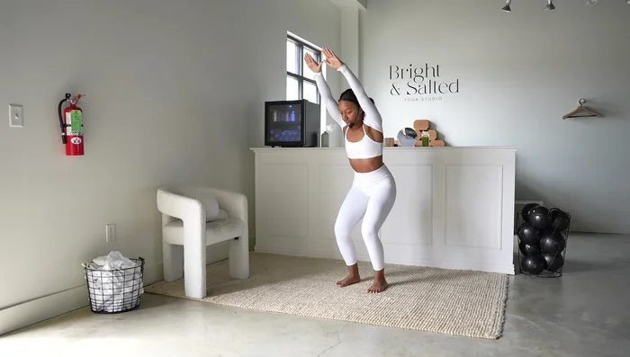 Chair Pose Shoulder Flys: Bend elbows and perform shoulder flys, closing and opening your arms while squeezing shoulder blades together. Maintain tension in knees and thighs.