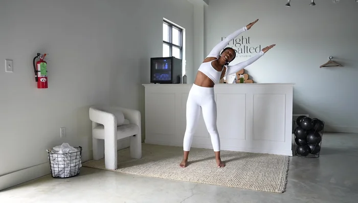 Oblique Twists: Feet shoulder-width apart, arms reaching up. Perform oblique twists, inhaling and exhaling as you twist to the left and right.