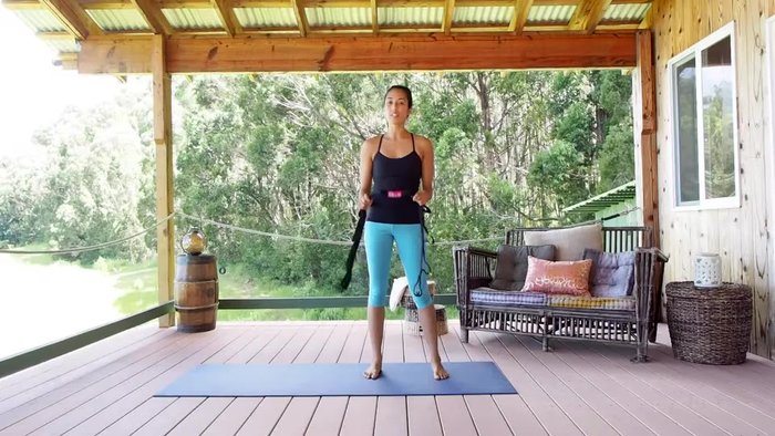 Sit up as straight as possible, holding the strap as far back as you comfortably can.