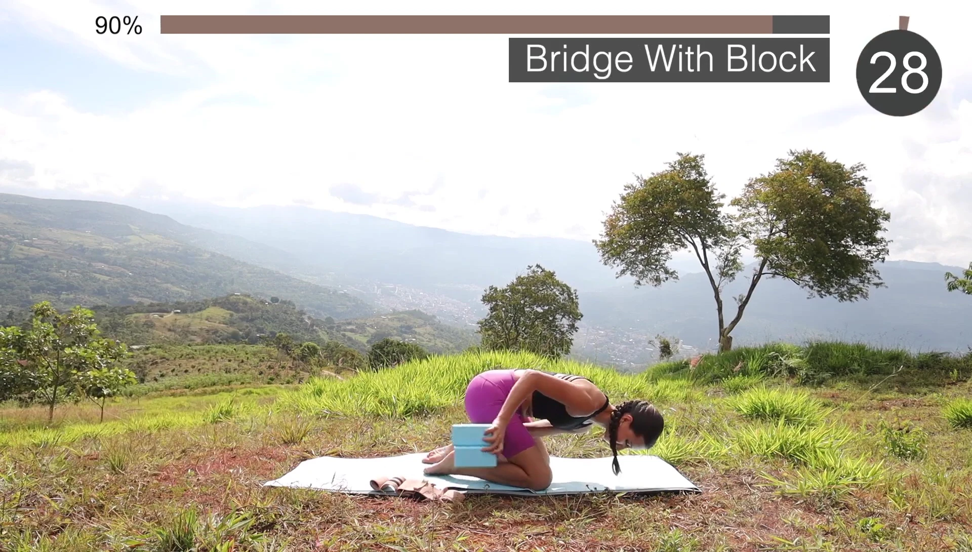 Supported bridge pose using a block.