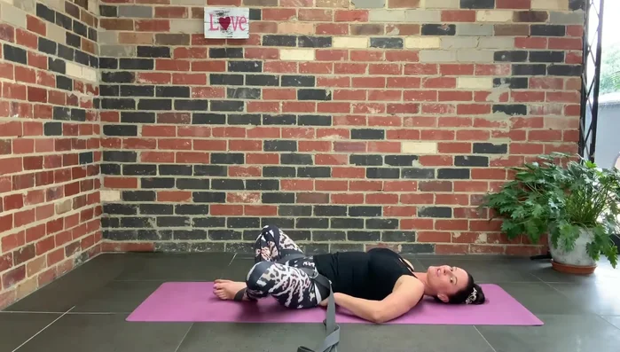 Optionally: Extend your arms overhead, palms facing the ceiling.