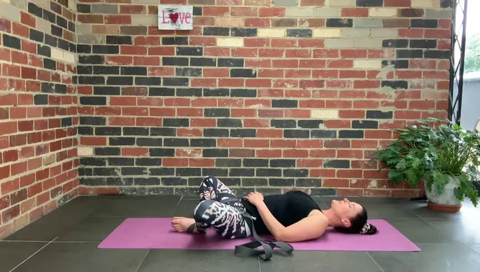 Optionally: Extend your arms overhead, palms facing the ceiling.