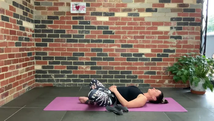 Optionally: Extend your arms overhead, palms facing the ceiling.