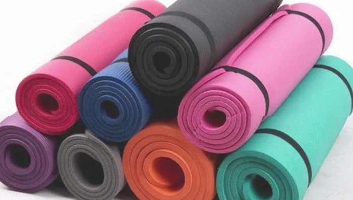 Evaluate thickness and cushioning. Thicker mats offer more cushioning but might make balancing harder. Thinner mats offer more stability.