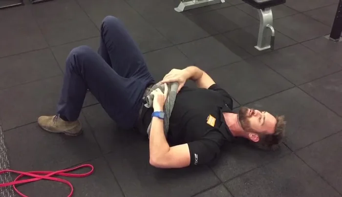 Allow your belly to rise into the towel, expanding into your sides and back.