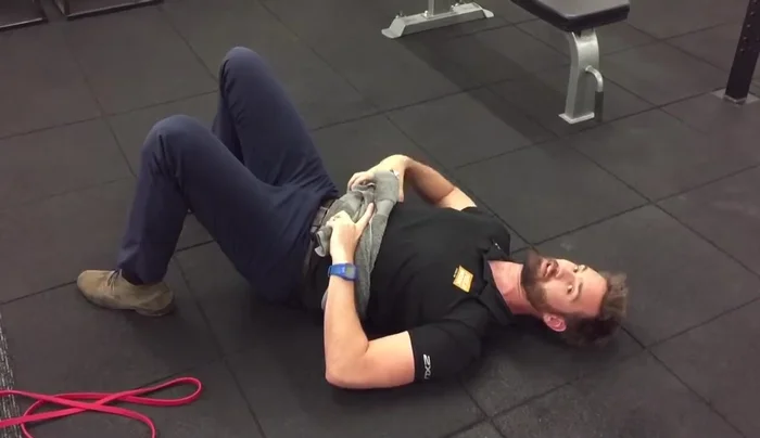 Allow your belly to rise into the towel, expanding into your sides and back.