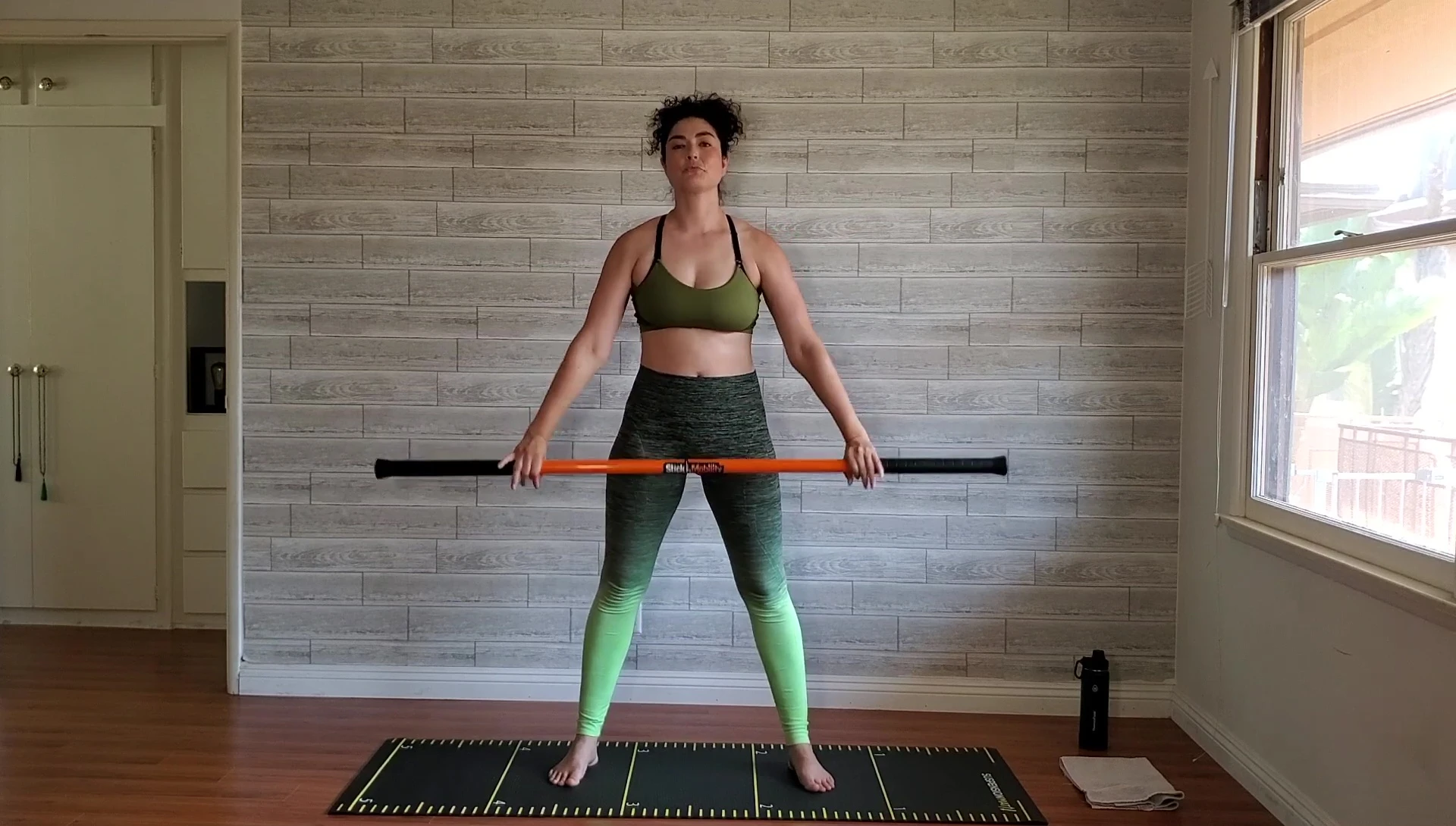 Woman performing the monkey pull exercise.